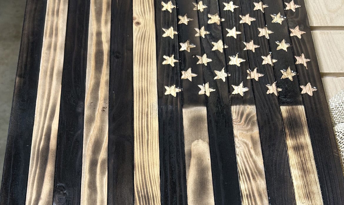 Fire-charred American flag wall décor handcrafted from wood