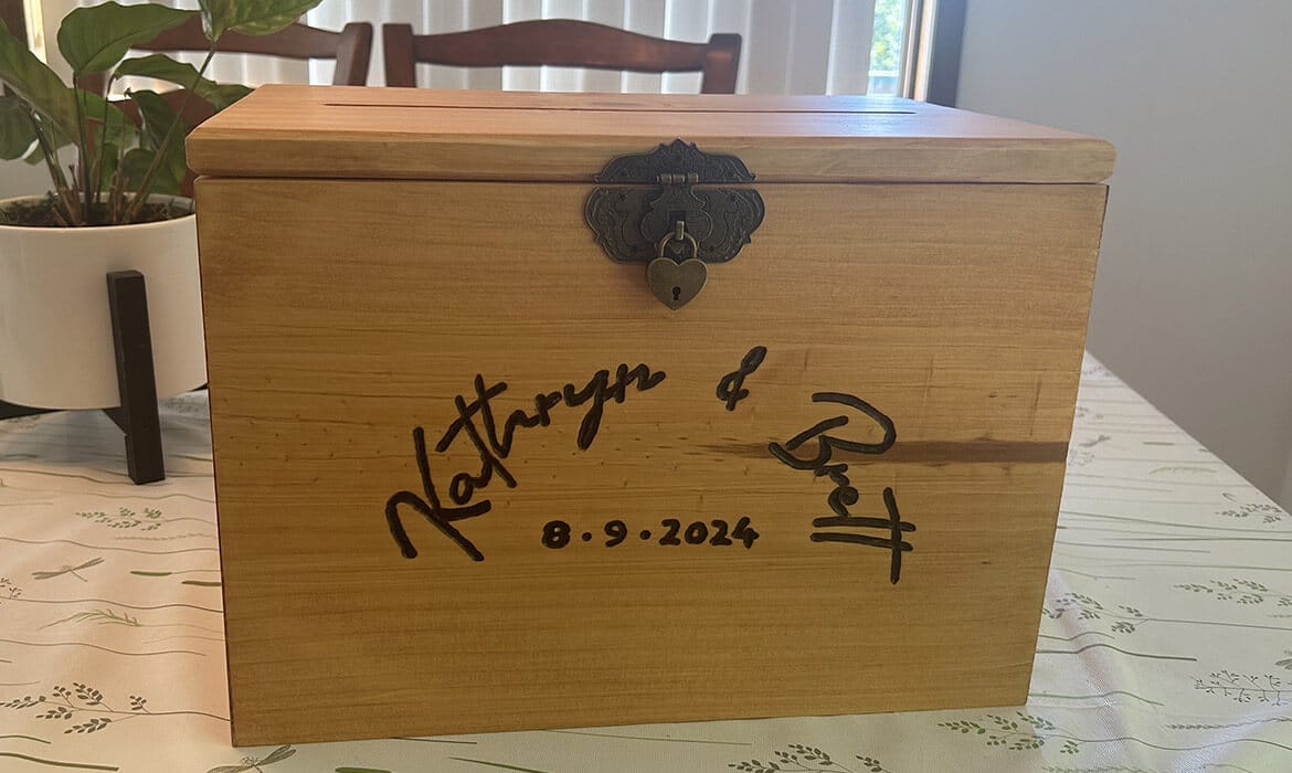 Personalized wooden wedding card box with hand-burned names and wedding date