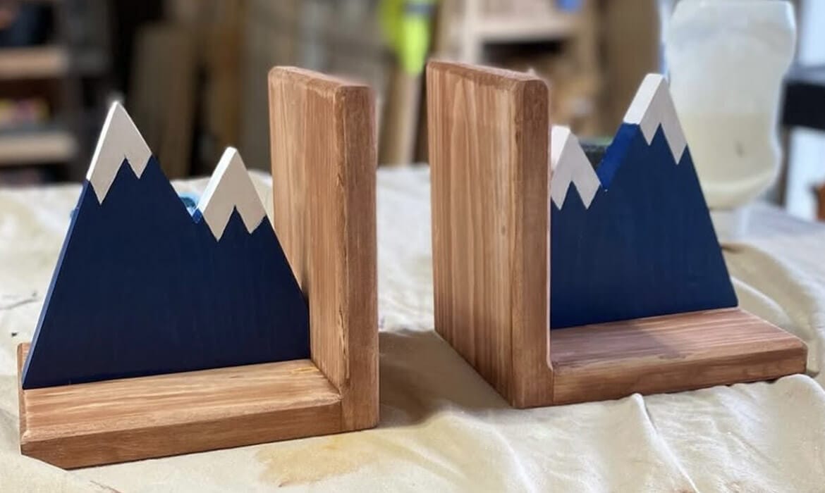 Wooden mountain bookends with hand-painted snow-capped mountain design